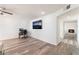 Open-concept living room with modern flooring, recessed lighting, and a view of the fireplace at 212 Huntly Rd, Las Vegas, NV 89145