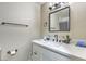 Updated bathroom featuring a modern sink, faucet and vanity with a contemporary mirror at 2129 N Michael Way, Las Vegas, NV 89108