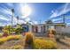 Charming single-story home with a red front door, drought-tolerant landscaping, and a welcoming curb appeal at 2129 N Michael Way, Las Vegas, NV 89108