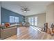 Bright living room area with modern lighting, fireplace and sliding glass door at 2129 N Michael Way, Las Vegas, NV 89108