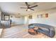 Open-concept living room featuring wood floors and a cozy seating arrangement at 2129 N Michael Way, Las Vegas, NV 89108