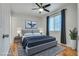 This bedroom features hardwood floors, ceiling fan, window with blinds, and a decorative rug at 2141 Twickenham Pl # A, Las Vegas, NV 89108