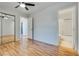 Bedroom features wood floors, an open doorway, and a mirrored sliding door closet at 2141 Twickenham Pl # A, Las Vegas, NV 89108