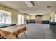 Community room featuring sofas, tables, and a bookshelf, creating a welcoming space at 2141 Twickenham Pl # A, Las Vegas, NV 89108