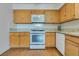 Bright kitchen with white appliances, lots of cabinet space and stone countertops at 2141 Twickenham Pl # A, Las Vegas, NV 89108