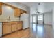 Bright kitchen with white appliances and an open concept that flows into the dining and living room at 2141 Twickenham Pl # A, Las Vegas, NV 89108