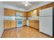 Bright kitchen with white appliances, lots of cabinet space and stone countertops at 2141 Twickenham Pl # A, Las Vegas, NV 89108