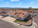 An aerial view of a single-Gathering home with tile roof, three-car garage, and desert landscaping at 2161 Avalon Dr, Laughlin, NV 89029