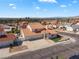 Aerial view of a community showcasing the home's roof tiles, large driveway and landscaping at 2161 Avalon Dr, Laughlin, NV 89029