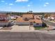 An aerial view of a single-Gathering home with tile roof, three-car garage, and desert landscaping at 2161 Avalon Dr, Laughlin, NV 89029