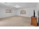 Spacious bonus room with plush carpeting, natural light, and decorative windows at 2161 Avalon Dr, Laughlin, NV 89029