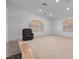 Spacious living room features laminate flooring, a fireplace, and large windows at 2161 Avalon Dr, Laughlin, NV 89029