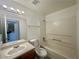 Bathroom featuring a single sink vanity, framed mirror, and shower-tub combo at 2525 Sierra Bello Ave # 103, Las Vegas, NV 89106