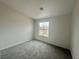 Neutral carpeting, a bright window, and fresh, neutral paint define this comfortable bedroom at 2525 Sierra Bello Ave # 103, Las Vegas, NV 89106