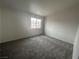 Neutral bedroom with carpet and a window for natural light at 2525 Sierra Bello Ave # 103, Las Vegas, NV 89106