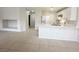 Open concept space featuring tile flooring, a kitchen island, and a white refrigerator at 2525 Sierra Bello Ave # 103, Las Vegas, NV 89106