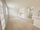 Open living room features neutral paint, tile flooring, and recessed niche for decor or storage at 2525 Sierra Bello Ave # 103, Las Vegas, NV 89106