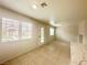 Bright living area with tile flooring, neutral paint, and multiple windows for natural light and backyard access at 2525 Sierra Bello Ave # 103, Las Vegas, NV 89106