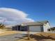 An exterior elevation shows a well-maintained yard, an American flag, and a blue house at 2731 W Huron Ln, Pahrump, NV 89048