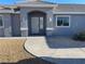 Charming front entrance of a single-story home with desert landscaping, creating a welcoming curb appeal at 2731 W Huron Ln, Pahrump, NV 89048