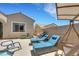 Relaxing backyard setting with a sparkling pool, lounge chairs, and a cozy swing set at 2756 Strathblane Ave, Henderson, NV 89044