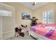 Cozy bedroom with neutral walls, ceiling fan, carpet, and a TV at 2756 Strathblane Ave, Henderson, NV 89044