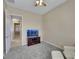 Bedroom featuring neutral walls, carpet, TV, and a recliner at 2756 Strathblane Ave, Henderson, NV 89044