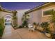 Private courtyard with a cozy seating area, elegant lighting, and lush greenery, perfect for relaxation at 2756 Strathblane Ave, Henderson, NV 89044