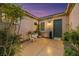 Inviting outdoor courtyard with bistro set, stylish lighting, and mature landscaping creating a serene retreat at 2756 Strathblane Ave, Henderson, NV 89044