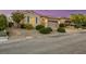 Charming single-story home featuring desert landscaping and a two-car garage at 2756 Strathblane Ave, Henderson, NV 89044