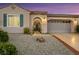 Inviting single-story home with desert landscaping, arched entry, and a two-car garage at 2756 Strathblane Ave, Henderson, NV 89044