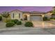 Well-maintained single-story home with a two-car garage and desert landscaping at 2756 Strathblane Ave, Henderson, NV 89044