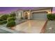 Charming single-story home featuring a two-car garage and lush landscaping at 2756 Strathblane Ave, Henderson, NV 89044