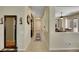 Hallway with tile flooring, decorative mirror, and a view into the dining room at 2756 Strathblane Ave, Henderson, NV 89044