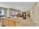 Open-concept kitchen featuring a large island and stainless steel appliances that connects to the living room at 2756 Strathblane Ave, Henderson, NV 89044