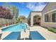 Beautiful backyard with a refreshing pool, spa, and lounge chairs, perfect for relaxation and entertaining at 2756 Strathblane Ave, Henderson, NV 89044