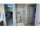 Modern shower stall with glass doors located adjacent to walk-in closet at 2764 Leys Burnett Ave, Henderson, NV 89044