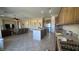 Open kitchen with granite countertops, stainless steel appliances, and views into the living room at 2764 Leys Burnett Ave, Henderson, NV 89044