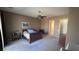 Large main bedroom with ceiling fan, ensuite bath, and multiple furnishings at 2764 Leys Burnett Ave, Henderson, NV 89044