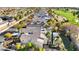 Expansive aerial shot of a residential neighborhood featuring lush green golf courses and mature trees at 2785 Soft Horizon Way, Las Vegas, NV 89135