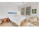 Sunlit bedroom featuring two windows, a seating area, and neutral tones at 2785 Soft Horizon Way, Las Vegas, NV 89135