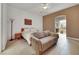 Spacious bedroom features neutral tones, a seating area, and an ensuite bathroom at 2785 Soft Horizon Way, Las Vegas, NV 89135