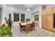 Elegant dining room with chandelier, natural lighting, and wicker seating at 2785 Soft Horizon Way, Las Vegas, NV 89135