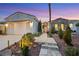 Inviting home with stone pathway, manicured landscaping, and a two-car garage at 2785 Soft Horizon Way, Las Vegas, NV 89135