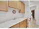 Laundry room with sink and bright cabinets at 2785 Soft Horizon Way, Las Vegas, NV 89135