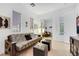 Bright living room features a cozy futon and mirrored closet doors at 2785 Soft Horizon Way, Las Vegas, NV 89135