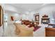 Bright and airy living room with a cozy fireplace and tile flooring at 2785 Soft Horizon Way, Las Vegas, NV 89135