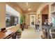 Well-lit home office boasts built-in shelving, a view to the exterior, and neutral tones at 2785 Soft Horizon Way, Las Vegas, NV 89135