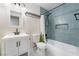 A charming bathroom features blue tile in the shower and a sleek vanity at 308 Fox Cir, Las Vegas, NV 89107