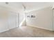 Comfortable bedroom with neutral carpet, a ceiling fan, and a window for natural light at 308 Fox Cir, Las Vegas, NV 89107